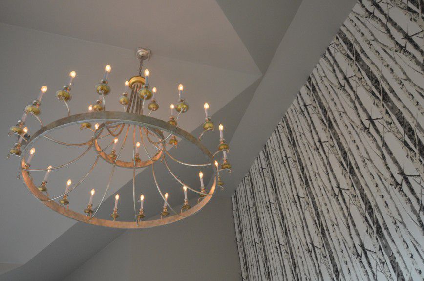 denver-interior-designers - An oversized antiqued modern chandelier to fill the peaked ceiling. Designed by Runa Novak of In Your Space Interior Design - InYourSpaceHome.com and RunaNovak.com