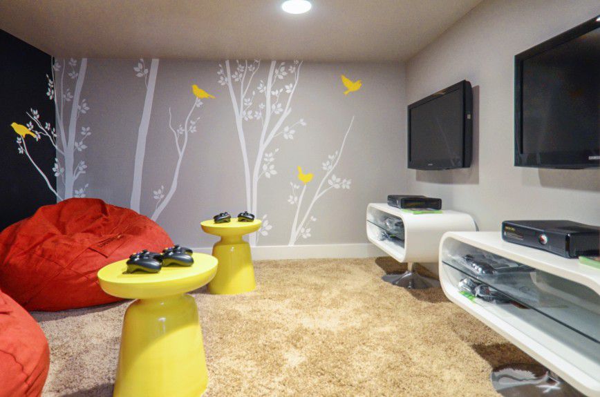 chicago-interior-decorators - A kid's media room in a secret room with chalkboard wall and bean bags designed by Runa Novak of In Your Space Interior Design - InYourSpaceHome.com and RunaNovak.com